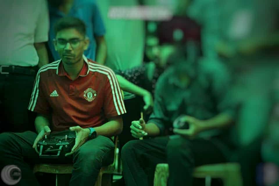 Robot operator holding a controller at a competition